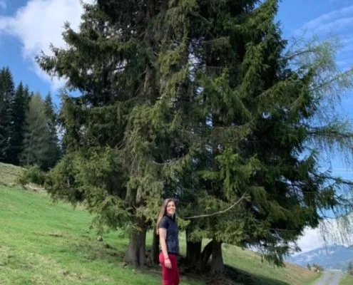 Woman standing on a rock in the mountains